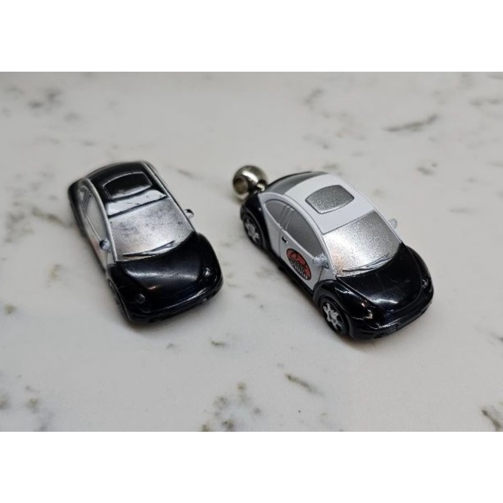 Pair of Geek Squad Volkswagen keychains